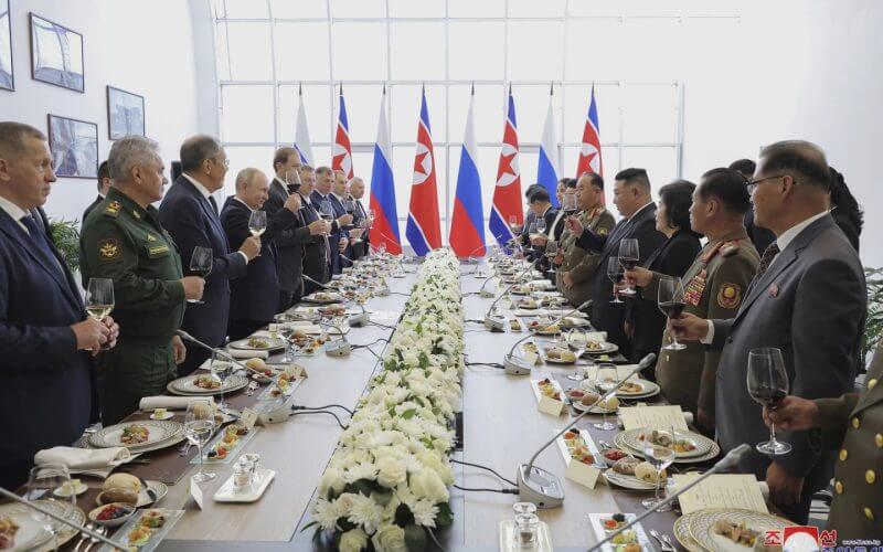 In this photo provided by the North Korean government, Russian President Vladimir Putin, fourth left, and North Korean leader Kim Jong Un, fourth right, toast after their talk at the Vostochny cosmodrome outside the city of Tsiolkovsky, about 200 kilometers (125 miles) from the city of Blagoveshchensk in the far eastern Amur region, Russia, Wednesday, Sept. 13, 2023. (Korean Central News Agency/Korea News Service via AP)