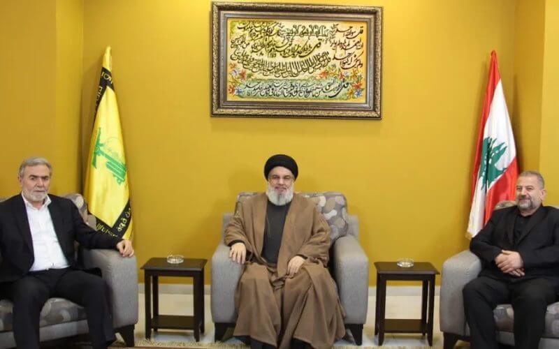 Handout picture provided by Hezbollah's media office, showing its leader Hassan Nasrallah meeting with Palestinian Islamic Jihad Secretary-General Ziad al-Nakhala (L) and Hamas' Deputy Chief Saleh al-Arouri at an undisclosed location in Lebanon. AFP