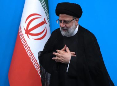 Iranian President Ebrahim Raisi places his hands on his heart as a gesture of respect as he leaves after a press conference in Tehran, Iran, Tuesday, Aug. 29, 2023. (AP Photo/Vahid Salemi)