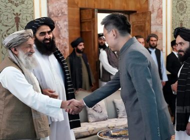 In this handout photo released by Taliban Prime Minister Media Office, China's new ambassador to Afghanistan Zhao Sheng shakes hand with Taliban Prime Minister Mohammad Hasan Akhund, left, during the recognition ceremony at the Presidential Palace, in Kabul, Afghanistan, Wednesday, Sept. 13, 2023. (Taliban Prime Minister Media Office via AP)