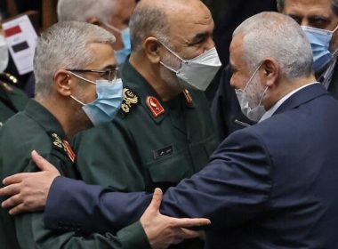 The leader of the Palestinian Hamas movement, Ismail Haniyeh (2nd R), shakes hands with Iranian Chief of Staff for the Armed Forces Mohammad Bagheri (L) and the commander of Iran's Revolutionary Guard force, General Hossein Salami (C), during the swearing in ceremony for Iran's new president at the parliament in the Islamic republic's capital Tehran on August 5, 2021. (Atta KENARE / AFP)