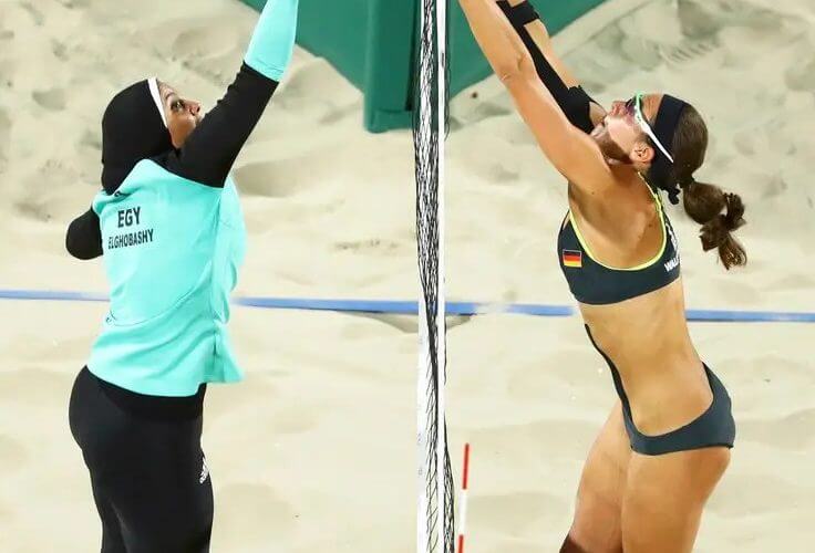 Doaa Elghobashy, left, of Egypt and Kira Walkenhorst of Germany compete in the women’s preliminary beach volleyball during the Olympics in Rio. Lucy Nicholson/Reuters