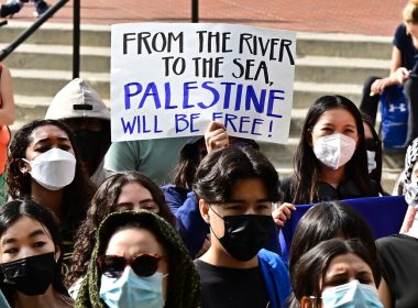 A participant holds a placard as students gather during a 'Walkout to fight Genocide and Free Palestine' at Bruin Plaza at UCLA (University of California, Los Angeles) in Los Angeles on October 25, 2023 (Frederic J. BROWN / AFP)