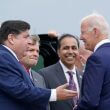 President Joe Biden greets Illinois Gov. J.B. Pritzker, from left, Rep. Mike Quigley, D-Ill., and Rep. Raja Krishnamoorthi, D-Ill., at O'Hare International Airport in Chicago, Thursday, Oct. 7, 2021. AP Photo/Susan Walsh