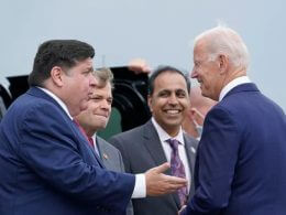 President Joe Biden greets Illinois Gov. J.B. Pritzker, from left, Rep. Mike Quigley, D-Ill., and Rep. Raja Krishnamoorthi, D-Ill., at O'Hare International Airport in Chicago, Thursday, Oct. 7, 2021. AP Photo/Susan Walsh