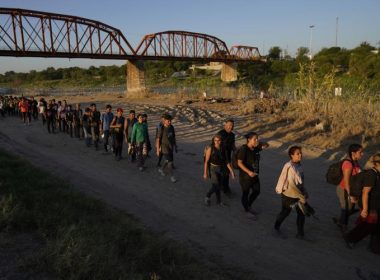 Migrants who crossed the Rio Grande and entered the U.S. from Mexico are lined up for processing by U.S. Customs and Border Protection, Sept. 23, 2023, in Eagle Pass, Texas. Eric Gay | AP