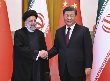 Visiting Iranian President Ebrahim Raisi, left, shakes hands with Chinese President Xi Jinping before their meeting at the Great Hall of the People in Beijing, February 14, 2023. (Yan Yan/Xinhua via AP)