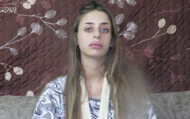 A screenshot from a clip published by the Hamas terror group on October 16, 2023, showing Mia Schem, an Israeli woman abducted by terrorists from a music festival during a massacre by Hamas gunmen on October 7, 2023. twitter.com