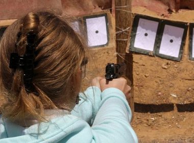 A girl shooting a pistol at a shooting range in Gush Etzion. Nati Shohat/Flash90