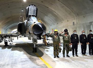 Pilots pose with an aircraft at a new underground Iranian air force base in this picture released Tuesday, Feb. 7, 2023. (Iranian Army)