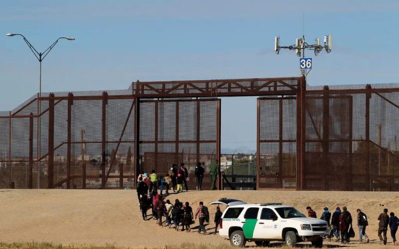 Migrants crossing from Mexico to surrender to the American authorities in El Paso, Texas. Jose Luis Gonzalez/Reuters