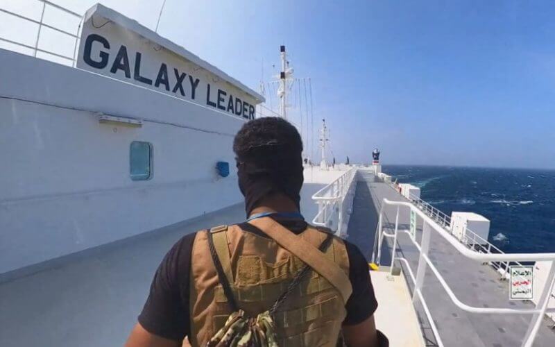 A Houthi fighter stands on the Galaxy Leader cargo ship in the Red Sea in this photo released November 20, 2023. Houthi Military Media