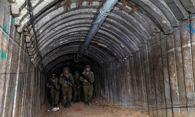 Israeli soldiers walk through the tunnel close to the Erez crossing. Photograph: Amir Cohen/Reuters