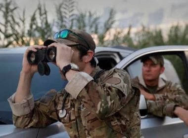 Two members of U.S. Border Patrol Search, Trauma, and Rescue (BORSTAR) team stake out a bend in the Rio Grande known for having illegal border crossers in the evening hours near Eagle Pass, Texas, June 20, 2019. CBP photo by Glenn Fawcett