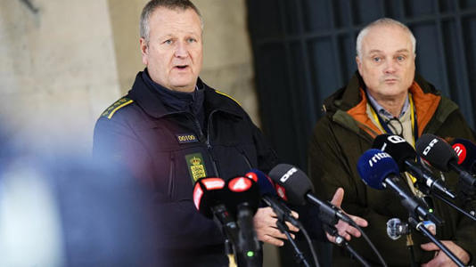 Chief police inspector and operational chief of intelligence service PET, Flemming Drejer (R) and senior police inspector and head of emergency services in Copenhagen Police, Peter Dahl hold a press briefing on a coordinated police action, at the police station in Copenhagen, on December 14, 2023. AFP