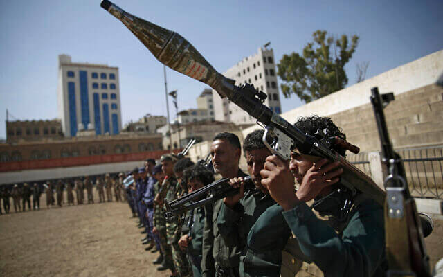 Houthi rebel fighters display their weapons during a gathering aimed at mobilizing more fighters for the Iranian-backed Houthi movement, in Sanaa, Yemen. AP/Hani Mohammed