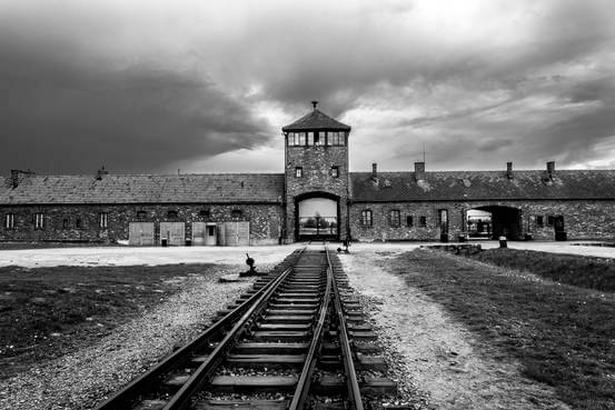 Railroad tracks lead into Auschwitz-Birkenau in Poland. ALAMY