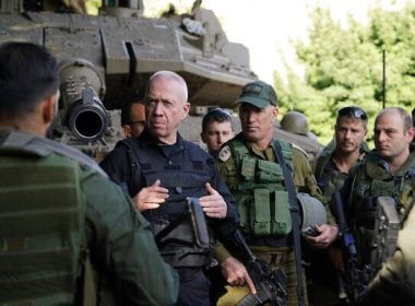 Defense Minister Yoav Gallant (center) speaks to reservist soldiers on the Lebanon border, December 17, 2023. (Ariel Hermoni/Defense Ministry)