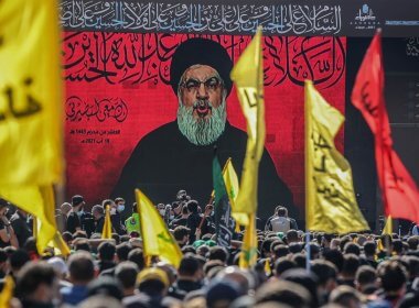 Hezbollah leader Hasan Nasrallah is shown on a screen during a rally in Beirut. Getty