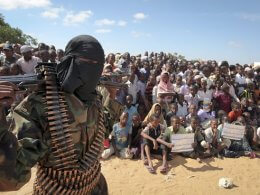 An armed member of al-Shabaab attends a rally in support of the merger of the Somali militant group with al Qaeda. AP
