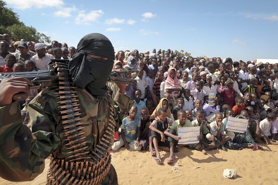 An armed member of al-Shabaab attends a rally in support of the merger of the Somali militant group with al Qaeda. AP