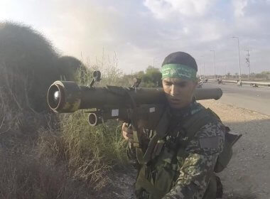 In this image from a body camera video during the Oct. 7, 2023, attack on Israel, a Hamas member holds a Russian-designed Strela anti-aircraft missile. South First Responders