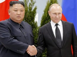 Russian President Vladimir Putin, right, and North Korea's leader Kim Jong Un shake hands during their meeting in Vladivostok, Russia. AP Photo