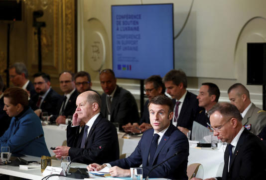 French President Emmanuel Macron, center right, delivers a speech at the Elysee Palace in Paris, Monday, Feb. 26, 2024. AP