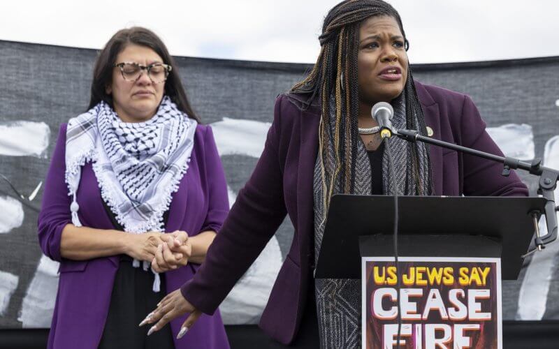 Rep. Cori Bush (D-MO) speaks as Rep. Rashida Tlaib (D-MI) listens during a demonstration calling for a ceasefire in Gaza near the Capitol in Washington on Wednesday, Oct. 18, 2023. AP
