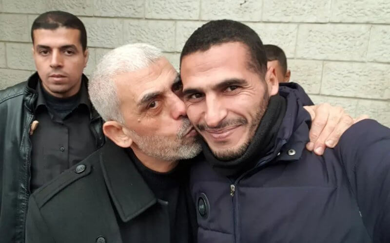 Hassan Eslaiah with Hamas commander Yahya Sinwar. Hassan Eslaiah