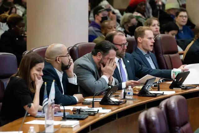 Alderman Anthony Napolitano, center, buries his face in his hands during a City Council meeting to discuss a resolution that would call for a cease-fire in Gaza, Wednesday, Jan. 31, 2024, in Chicago. AP