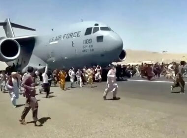 Desperate to flee, Afghans ran alongside a U.S. military plane in Kabul. AP