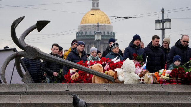 People lay flowers at a spontaneous memorial in memory of the victims of Moscow attack in St. Petersburg, Russia, Sunday, March 24, 2024. (AP Photo/Dmitri Lovetsky)