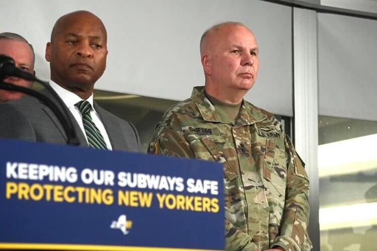 New York State Police Superintendant Steven James, left, and Maj. Gen. Raymond Shields listen as Gov. Kathy Hochul and MTA Chairman and CEO Janno Lieber make a subway safety announcement at the New York City Transit Rail Control Center on Wednesday, Mar 6, 2024. Metropolitan Transportation Authority
