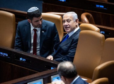 Prime Minister Benjamin Netanyahu, right, with Communications Minister Shlomo Karhi during a discussion and a vote in the Knesset, in Jerusalem, on March 1, 2023. (Yonatan Sindel/Flash90)