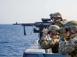 Marines participate in a defense of the amphibious task force gunnery exercise in the East China Sea. Department of Defense
