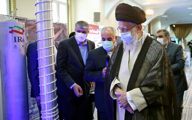 Iranian Supreme Leader Ayatollah Ali Khamenei, right, visits an exhibition of Iran’s nuclear achievements. AP