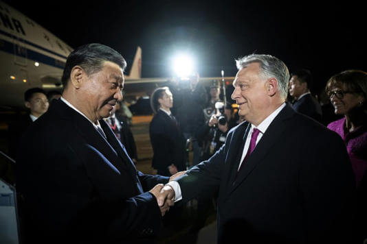 Chinese President Xi Jinping is greeted by Hungarian Prime Minister Viktor Orban. AFP
