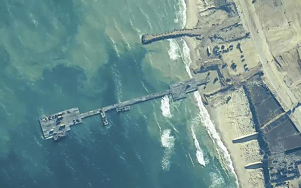 U.S. Army soldiers assigned to the 7th Transportation Brigade (Expeditionary), U.S. Navy sailors assigned to Amphibious Construction Battalion 1 and Israel Defense Forces place the Trident Pier on the coast of Gaza Strip on May 16, 2024. centcom.mil