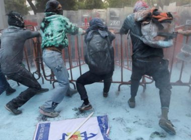 Demonstrators pull a fence during a protest in support of Palestinians outside the Israel Embassy in Mexico City, May 28, 2024. Reuters