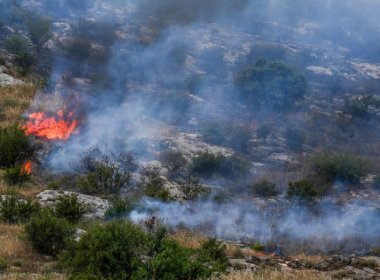 Smoke and fire after rockets fired from Lebanon hit an open area near the northern Israeli city of Kiryat Shmona, May 23, 2024. (Photo: Ayal Margolin/Flash90)