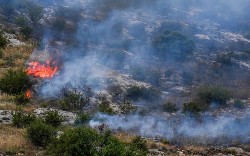 Smoke and fire after rockets fired from Lebanon hit an open area near the northern Israeli city of Kiryat Shmona, May 23, 2024. (Photo: Ayal Margolin/Flash90)