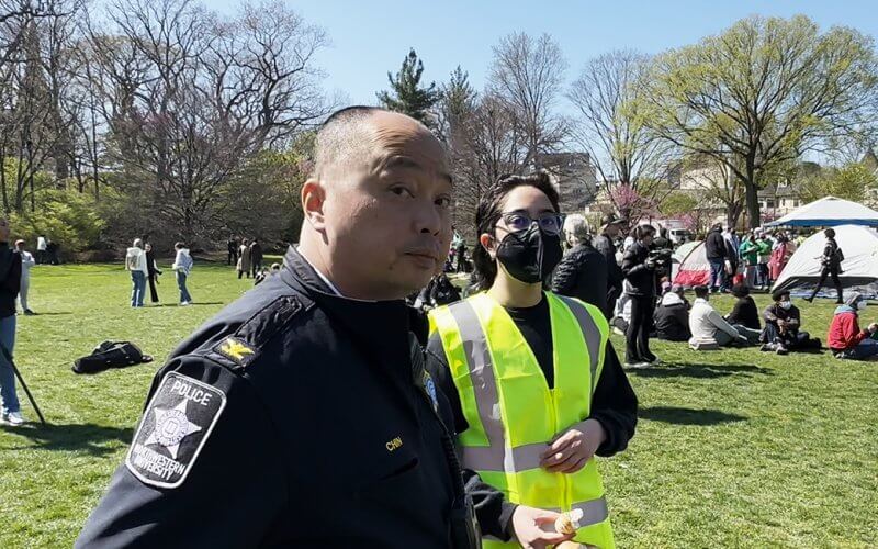 Northwestern University Deputy Police Chief Eric Chin and an anti-Israel protester are asked to return flags stolen from a local resident.