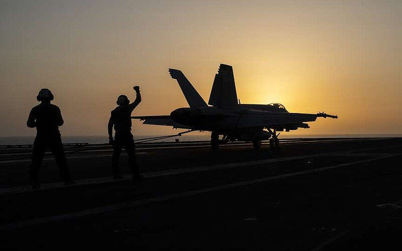 A fighter jet lands on the USS Dwight D. Eisenhower, also known as "IKE," in the Red Sea on Tuesday, June 11, 2024. AP