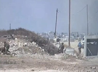 A screenshot of a video released by the IDF showing soldiers and members of a UN aid convoy taking cover during a mortar attack in central Gaza on June 25, 2024. twitter.com