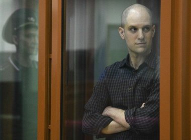 Wall Street Journal reporter Evan Gershkovich stands in the glass defendants’ cage in the Yekaterinburg courthouse where his trial began on June 26. AP