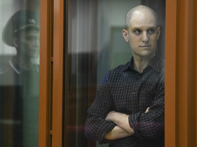 Wall Street Journal reporter Evan Gershkovich stands in the glass defendants’ cage in the Yekaterinburg courthouse where his trial began on June 26. AP