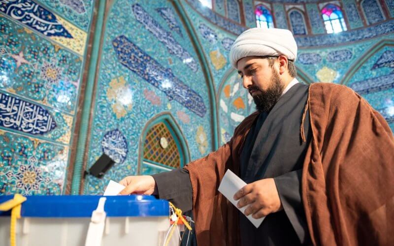 Voting at a polling station in Tehran. Getty