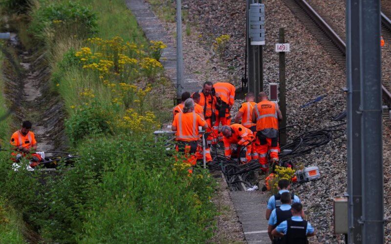 Railway staff and police work to repair one of several sites where vandals targeted France's high-speed train network, in the northern villege of Croisilles, on Friday. Reuters