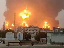 A handout picture obtained from Yemen’s Houthi Ansarullah Media Center show a huge column of fire erupting following Israeli strikes in the Yemeni rebel-held port city of Hodeida on July 20, 2024. AFP